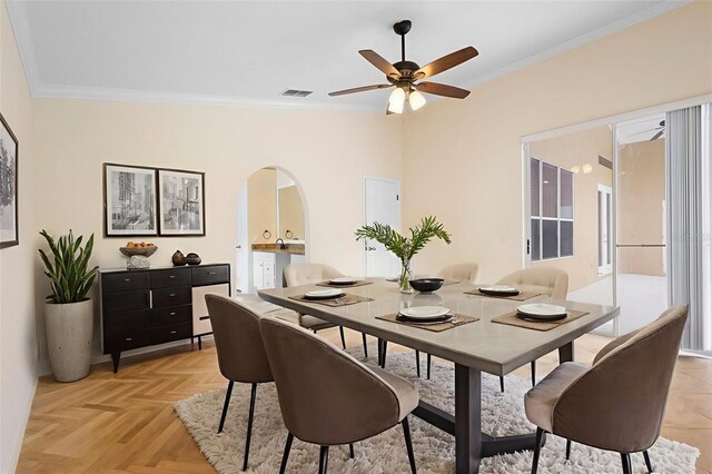 2263 Catbriar Way, Oviedo, FL 32765 - dining space with arched walkways, a ceiling fan, and ornamental molding