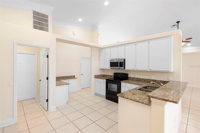 2263 Catbriar Way, Oviedo, FL 32765 - kitchen featuring black / electric stove, stainless steel microwave, a peninsula, light tile patterned floors, and stone countertops