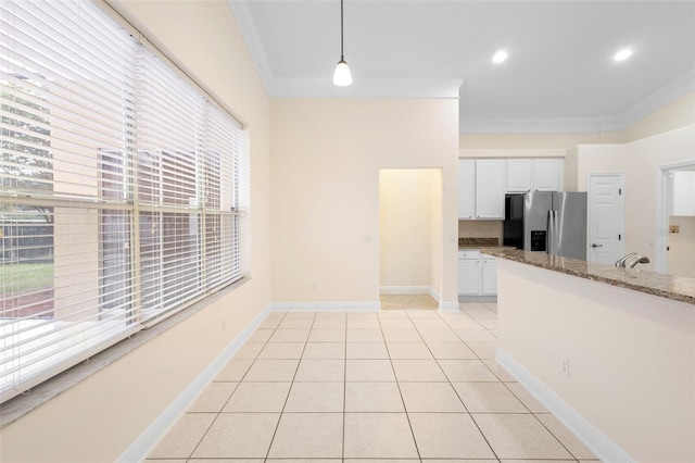2263 Catbriar Way, Oviedo, FL 32765 - kitchen with stainless steel refrigerator with ice dispenser, crown molding, white cabinets, pendant lighting, and light stone counters
