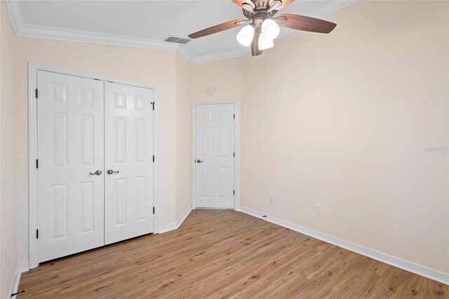2263 Catbriar Way, Oviedo, FL 32765 - unfurnished bedroom with crown molding, light wood finished floors, a closet, and ceiling fan