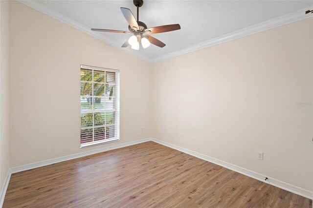 2263 Catbriar Way, Oviedo, FL 32765 - spare room featuring wood finished floors, vaulted ceiling, ornamental molding, and ceiling fan