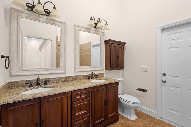 2263 Catbriar Way, Oviedo, FL 32765 - bathroom with a chandelier, double vanity, and tile patterned flooring