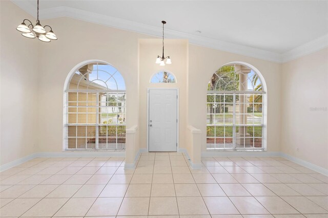 2263 Catbriar Way, Oviedo, FL 32765 - entryway with a chandelier, light tile patterned flooring, vaulted ceiling, and ornamental molding