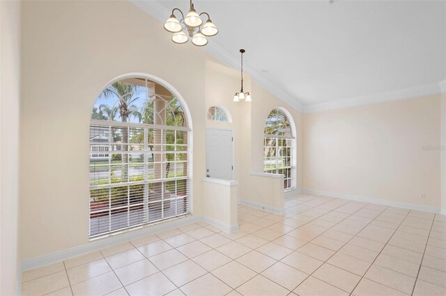 2263 Catbriar Way, Oviedo, FL 32765 - empty room featuring a chandelier, ornamental molding, vaulted ceiling, and tile patterned floors