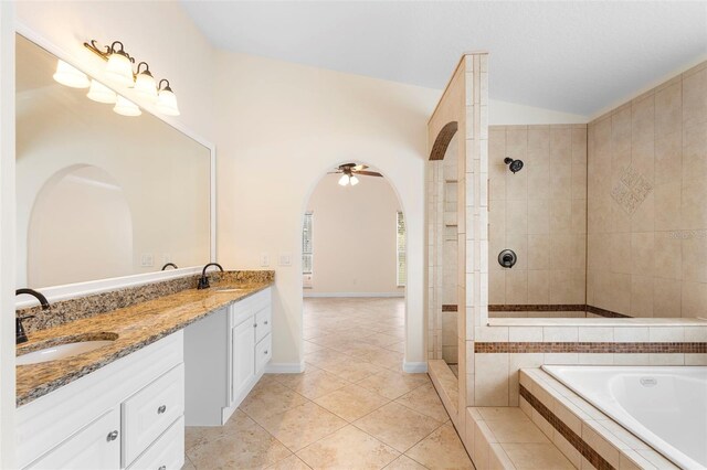 2263 Catbriar Way, Oviedo, FL 32765 - full bath with a garden tub, double vanity, a tile shower, tile patterned flooring, and a ceiling fan