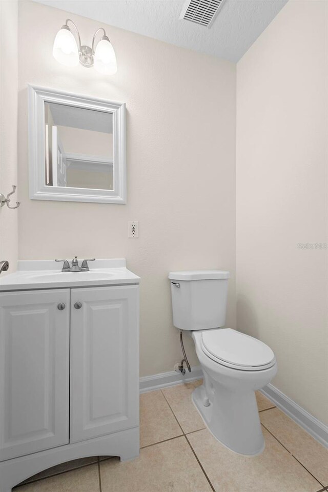2263 Catbriar Way, Oviedo, FL 32765 - half bathroom featuring tile patterned flooring, vanity, and a textured ceiling