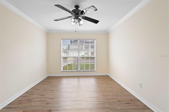 2263 Catbriar Way, Oviedo, FL 32765 - spare room with wood finished floors, a ceiling fan, and crown molding