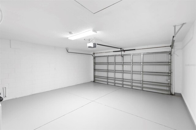 2263 Catbriar Way, Oviedo, FL 32765 - garage with a garage door opener and concrete block wall
