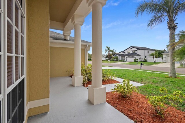2263 Catbriar Way, Oviedo, FL 32765 - covered porch with a residential view and a yard