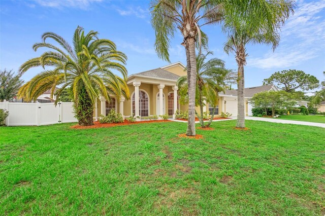 2263 Catbriar Way, Oviedo, FL 32765 - view of front facade with an attached garage, stucco siding, and driveway
