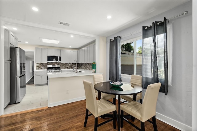 812 Faulkner St, New Smyrna Beach, FL 32168 - dining area featuring recessed lighting and light wood-type flooring