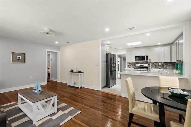 812 Faulkner St, New Smyrna Beach, FL 32168 - living area with recessed lighting and light wood-type flooring
