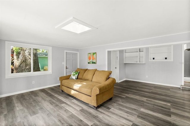 812 Faulkner St, New Smyrna Beach, FL 32168 - living room featuring a skylight and wood finished floors