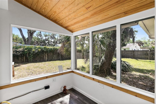 812 Faulkner St, New Smyrna Beach, FL 32168 - unfurnished sunroom with vaulted ceiling, wood finished floors, plenty of natural light, and wooden ceiling