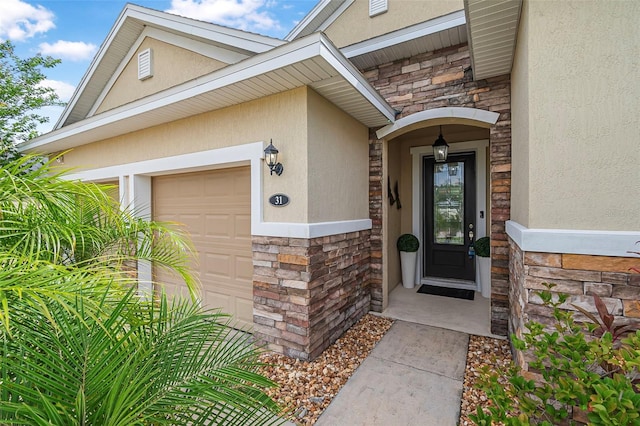 31 Abacus Ave, Ormond Beach, FL 32174 - property entrance with stone siding, stucco siding, and an attached garage