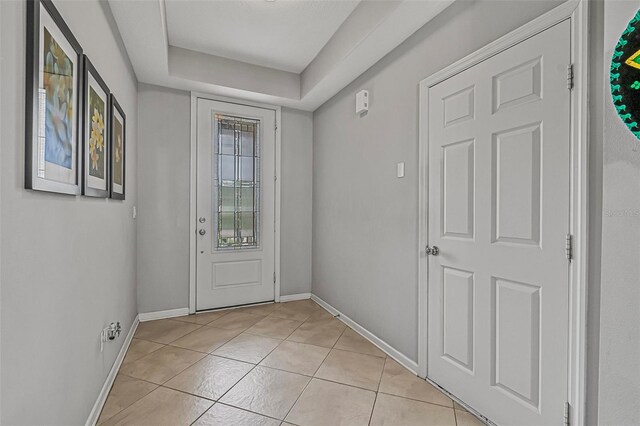 31 Abacus Ave, Ormond Beach, FL 32174 - entryway with light tile patterned floors and baseboards