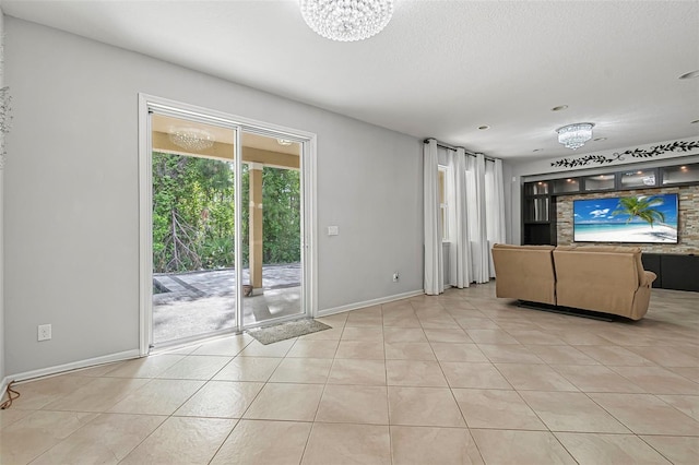 31 Abacus Ave, Ormond Beach, FL 32174 - unfurnished living room with light tile patterned floors and a chandelier