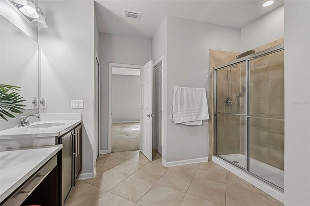 31 Abacus Ave, Ormond Beach, FL 32174 - full bathroom with vanity, a shower stall, and tile patterned floors