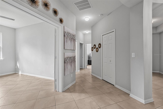31 Abacus Ave, Ormond Beach, FL 32174 - hallway with light tile patterned floors and baseboards