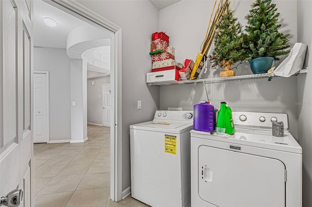 31 Abacus Ave, Ormond Beach, FL 32174 - washroom with washing machine and clothes dryer and light tile patterned flooring