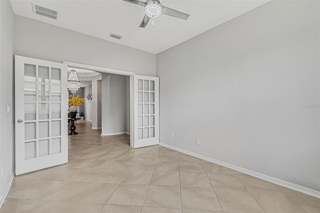 31 Abacus Ave, Ormond Beach, FL 32174 - unfurnished room with ceiling fan, french doors, a chandelier, and light tile patterned floors