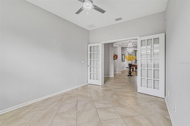 31 Abacus Ave, Ormond Beach, FL 32174 - empty room with french doors, ceiling fan, a chandelier, and light tile patterned floors