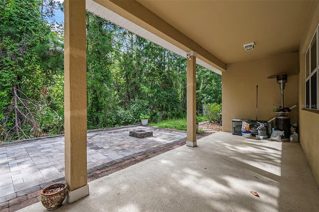 31 Abacus Ave, Ormond Beach, FL 32174 - view of patio / terrace with an outdoor fire pit