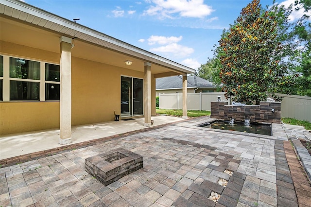 31 Abacus Ave, Ormond Beach, FL 32174 - view of patio featuring a fire pit