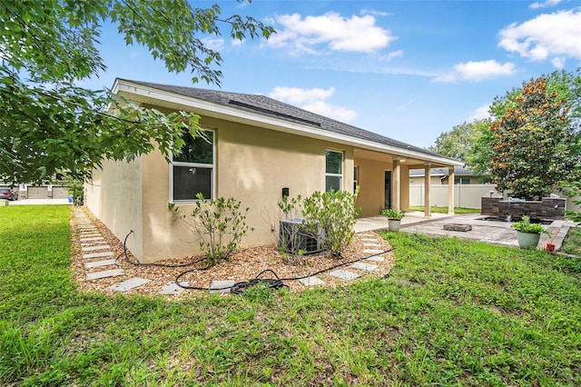 31 Abacus Ave, Ormond Beach, FL 32174 - rear view of house with stucco siding and a patio