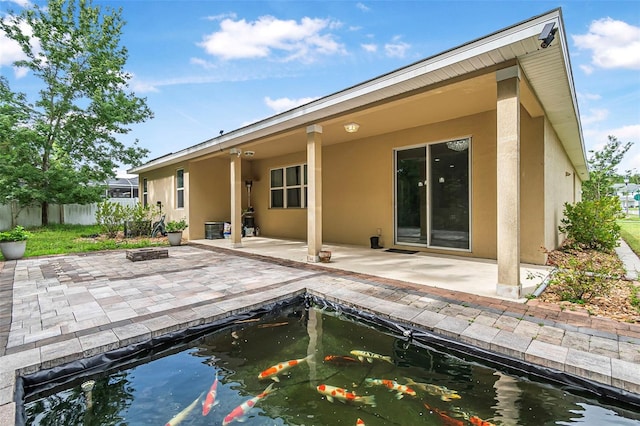 31 Abacus Ave, Ormond Beach, FL 32174 - rear view of property featuring stucco siding and a patio area