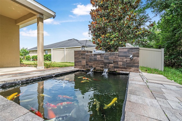 31 Abacus Ave, Ormond Beach, FL 32174 - swimming pool with a garden pond