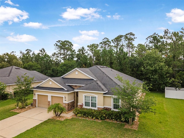 31 Abacus Ave, Ormond Beach, FL 32174 - view of front of home with stone siding, stucco siding, an attached garage, and driveway