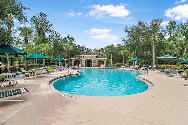 31 Abacus Ave, Ormond Beach, FL 32174 - community pool with a patio and view of scattered trees