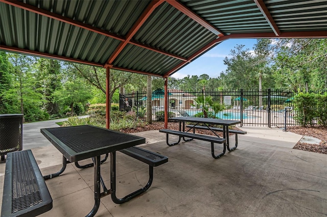 31 Abacus Ave, Ormond Beach, FL 32174 - view of patio / terrace featuring view of wooded area