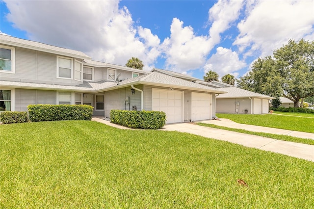 961 S Lakewood Ter Unit C, Port Orange, FL 32127 - view of front of property with a garage, a front lawn, and concrete driveway