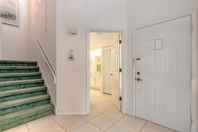 961 S Lakewood Ter Unit C, Port Orange, FL 32127 - entryway with light tile patterned floors and stairway