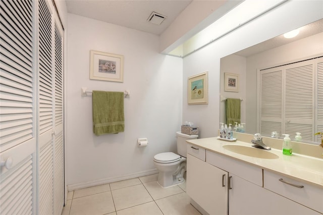 961 S Lakewood Ter Unit C, Port Orange, FL 32127 - bathroom featuring a closet, vanity, and tile patterned flooring