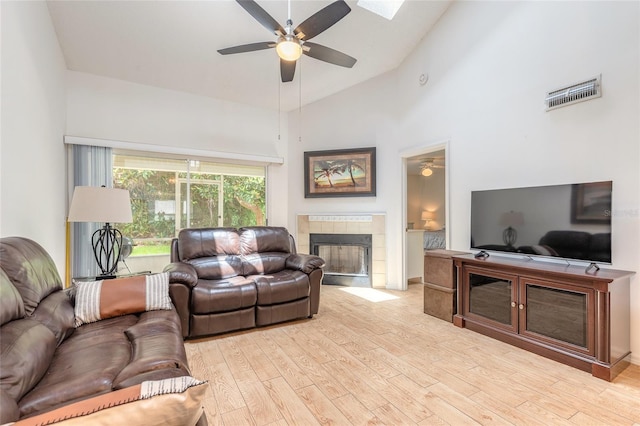 961 S Lakewood Ter Unit C, Port Orange, FL 32127 - living room with ceiling fan, a fireplace, wood finished floors, and high vaulted ceiling