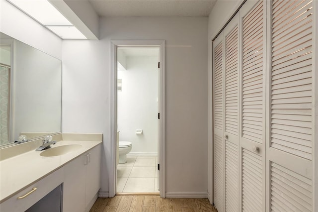 961 S Lakewood Ter Unit C, Port Orange, FL 32127 - full bathroom featuring a closet, vanity, and wood finished floors