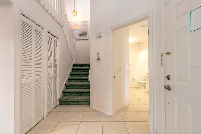 961 S Lakewood Ter Unit C, Port Orange, FL 32127 - hall with stairway and light tile patterned flooring