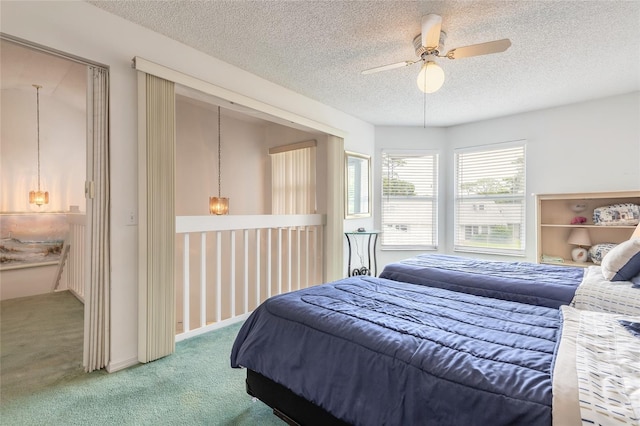 961 S Lakewood Ter Unit C, Port Orange, FL 32127 - carpeted bedroom with a textured ceiling and ceiling fan
