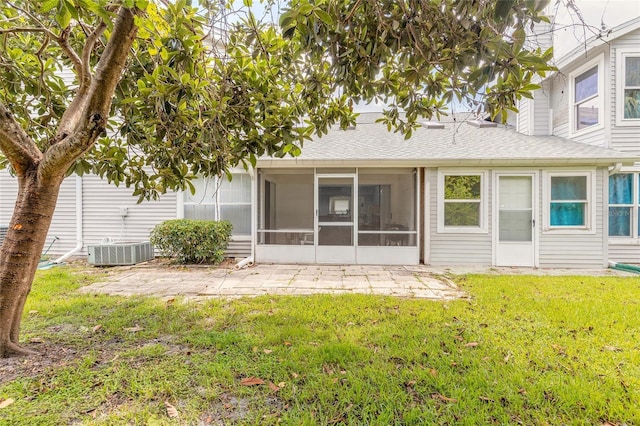 961 S Lakewood Ter Unit C, Port Orange, FL 32127 - back of house with a sunroom, a patio, a lawn, and roof with shingles