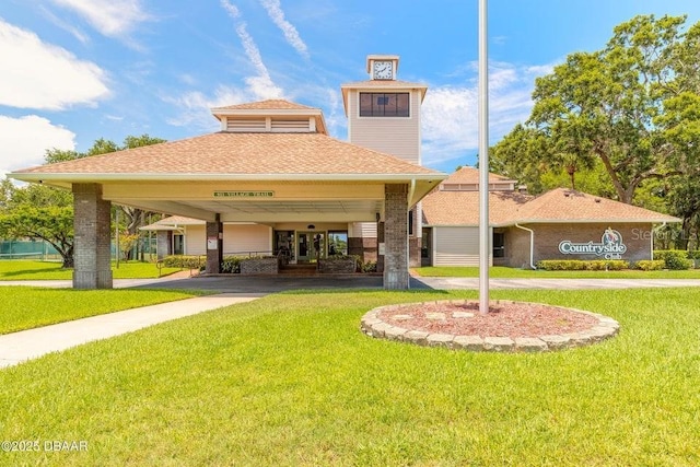 961 S Lakewood Ter Unit C, Port Orange, FL 32127 - back of property with a yard and roof with shingles
