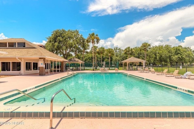 961 S Lakewood Ter Unit C, Port Orange, FL 32127 - community pool featuring a gazebo and a patio area