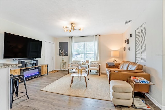 1455 Whitewood Dr, Deltona, FL 32725 - living room featuring light wood finished floors and baseboards