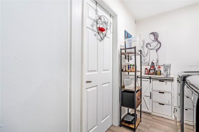 1455 Whitewood Dr, Deltona, FL 32725 - interior space featuring washing machine and clothes dryer and light wood-style flooring