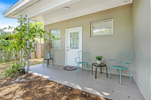 1455 Whitewood Dr, Deltona, FL 32725 - entrance to property featuring a patio area and stucco siding