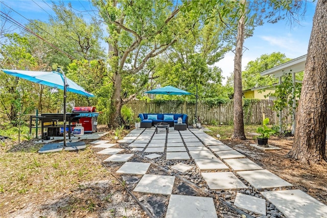 1455 Whitewood Dr, Deltona, FL 32725 - fenced backyard featuring outdoor lounge area and a patio area