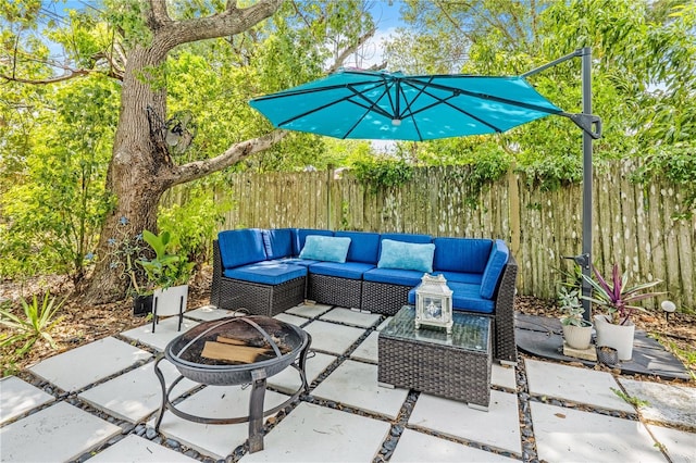 1455 Whitewood Dr, Deltona, FL 32725 - view of patio / terrace with an outdoor living space with a fire pit