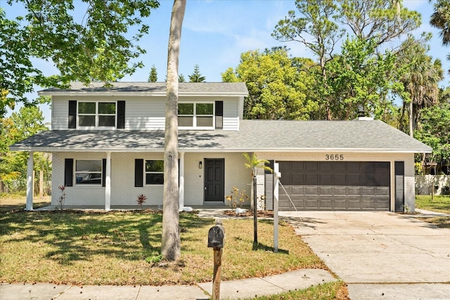 3655 Scott St, Port Orange, FL 32129 - traditional-style home featuring an attached garage, brick siding, and a front lawn